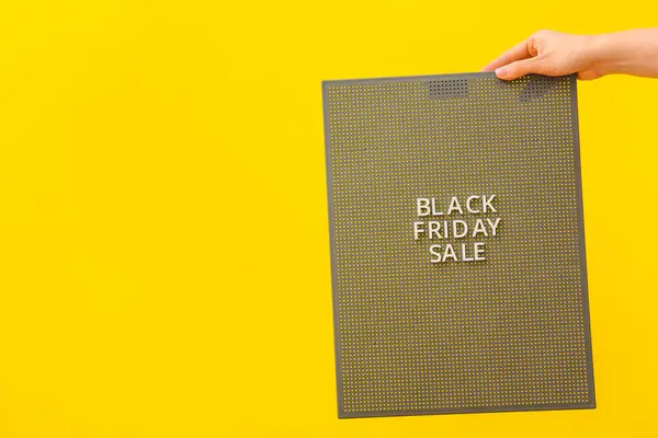 Female Hand Holding Board Text Black Friday Sale Color Background — Stock Photo, Image