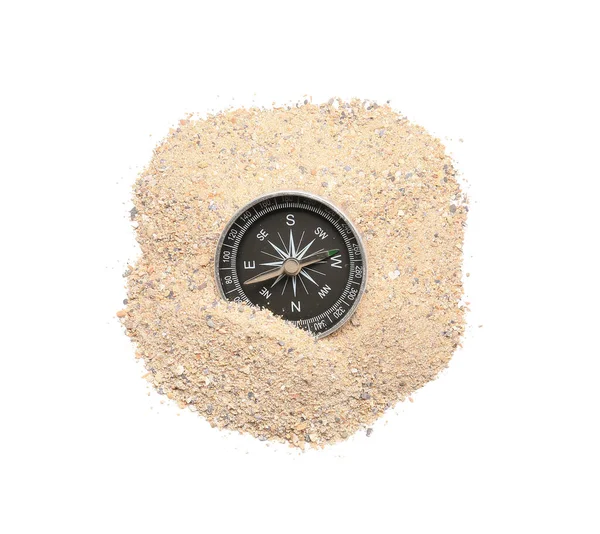 Vintage compass and sand on white background