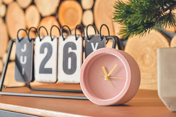 Calendar Alarm Clock Table Wooden Wall Room Closeup — Stock Photo, Image