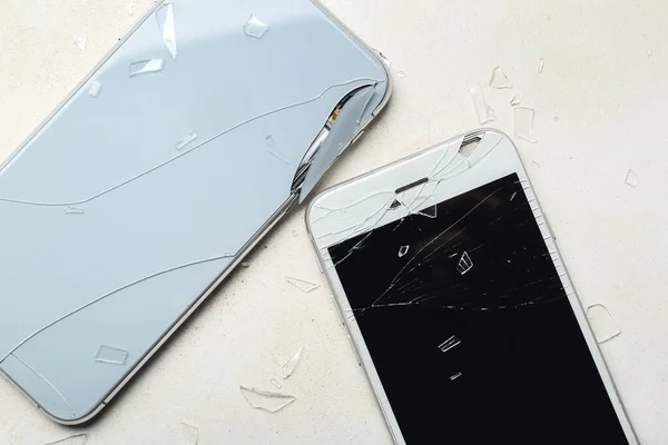 Broken Mobile Phones Pieces Shattered Glass White Background Closeup — Stock Photo, Image