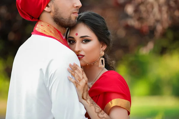 Beautiful Indian wedding couple on summer day