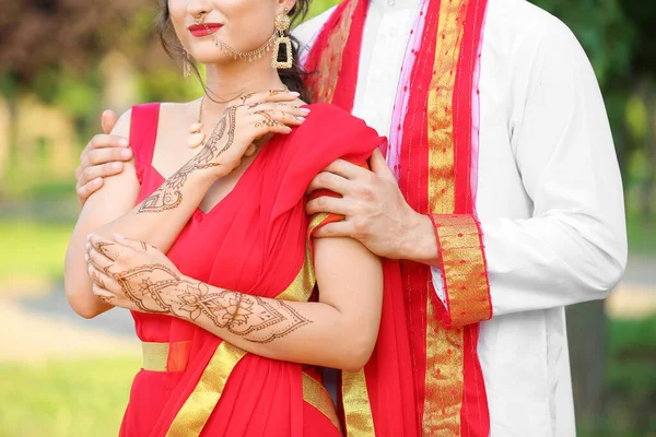 Beautiful Indian wedding couple outdoors