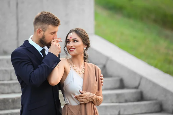 Beautiful Indian wedding couple outdoors