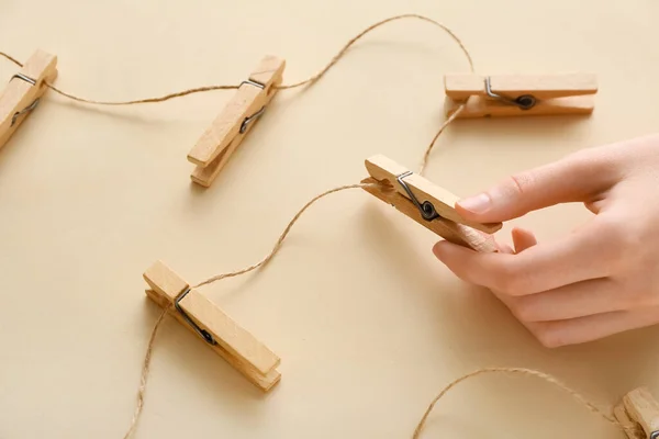 Female Hand Clothespins Rope Beige Background — Stock Photo, Image