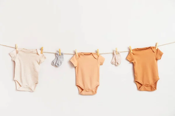 Different Baby Clothes Socks Hanging Rope White Background — Stock Photo, Image