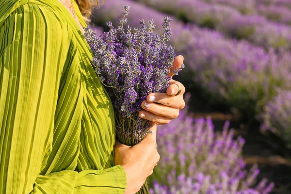 Beautiful young woman in lavender field, closeup