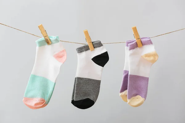 Three Pair Socks Hanging Rope Grey Background — Stock Photo, Image