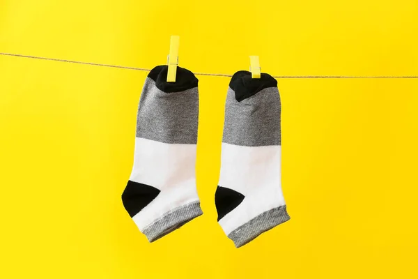 Pair Socks Hanging Rope Yellow Background — Stock Photo, Image