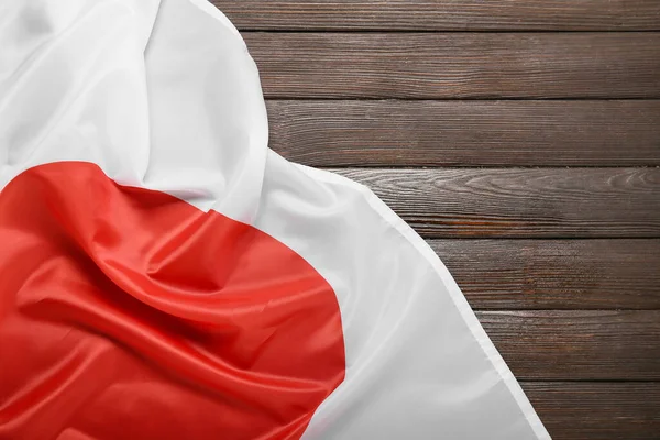 木制背景下的日本国旗 — 图库照片