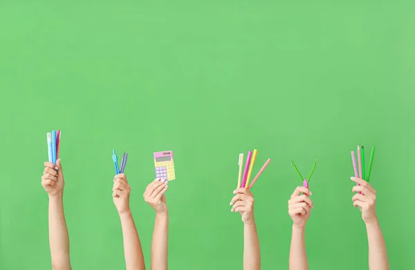 Many Different Hands School Supplies Green Background — Stock Photo, Image