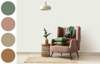 Koltuk ve okaliptüs dalları odadaki sehpanın üzerinde vazoda. Farklı renk desenleri