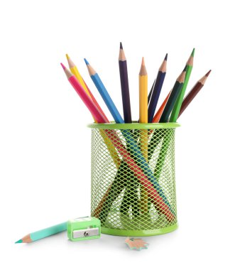 Metal holder with colorful pencils and sharpener on white background
