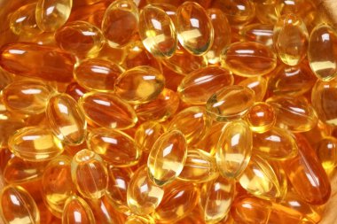 Arka plan olarak E vitamini hapları, yakın plan