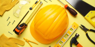 Sarı arka planda farklı inşaat araçları ve başlık düzenleme