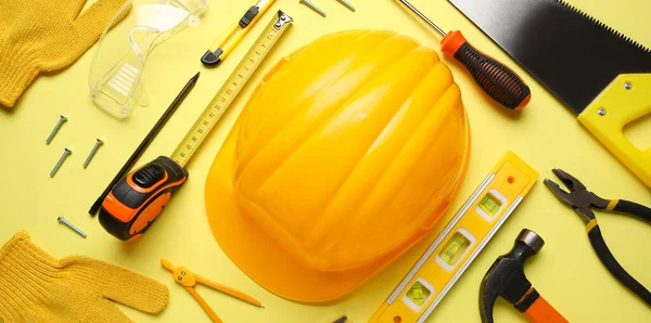 Sarı arka planda farklı inşaat araçları ve başlık düzenleme