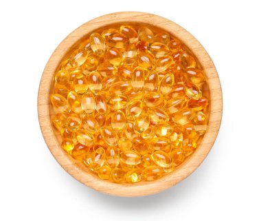 Beyaz zemin üzerinde E vitamini kapsülleri olan kase