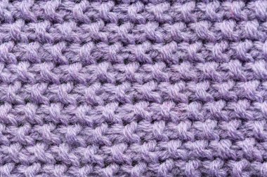 Violet arka plan olarak örgü ördü, yakın plan
