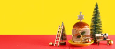 Noel dekorlu lezzetli hamburger ekmeği ve metin için yeri olan renkli arkaplan hediyesi.