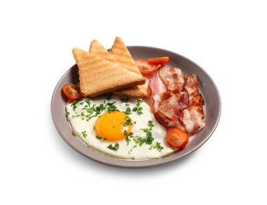 Plate with tasty fried egg, bacon, tomatoes and toasts on white background