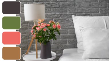 Gri tuğla duvarın yanındaki komodinin üzerinde bir buket taze gül olan vazo. Farklı renk desenleri