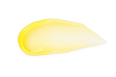 Beyaz arkaplanda sarı kozmetik yağı örneği