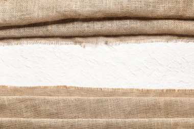 Işık arkaplan üzerinde çuval bezi kumaşı