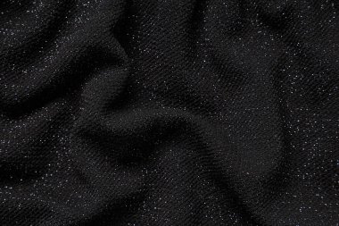 Arkaplan olarak simli siyah örgü kumaş dokusu