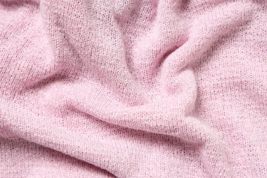 Arka plan olarak pembe örülmüş kumaş dokusu