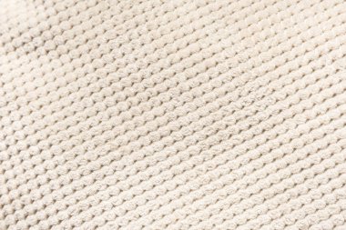 Arka plan olarak yumuşak bej waffle desenli kumaş