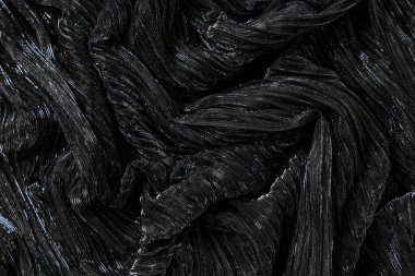 Arkaplan olarak siyah parlak kumaşın dokusu