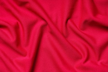 Arkaplan olarak parlak kırmızı kumaşın dokusu