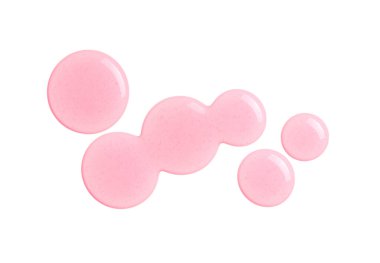 Beyaz arka planda pembe kozmetik yağ damlaları