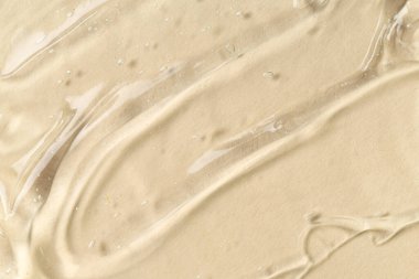 Bej arkaplanda kozmetik yağ dokusu