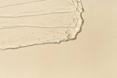 Bej arkaplanda kozmetik yağ dokusu