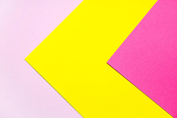 Pink and yellow sheets of paper as background