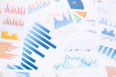 Arkaplan olarak grafikleri olan birçok iş belgesi, bulanık görünüm