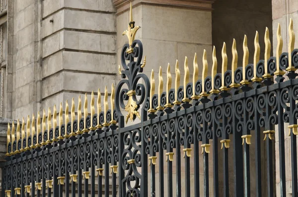 Wrought iron gate decorated with golden — Stock Photo, Image