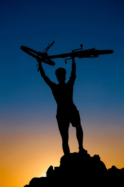 Mountain biker silhouette on the sunset — Stock Photo, Image