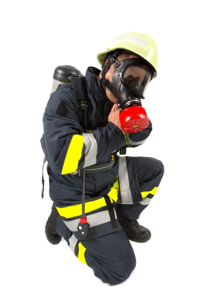 Bombeiro em uniforme isolado em branco — Fotografia de Stock