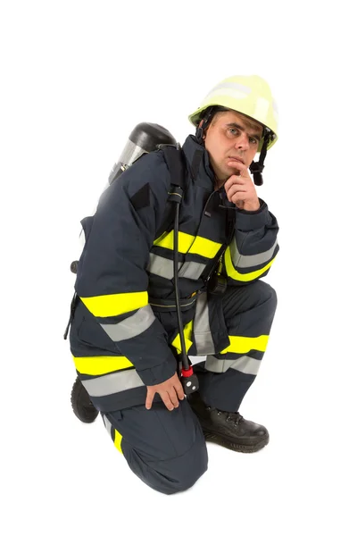 Fireman in uniform isolated in white — Stock Photo, Image