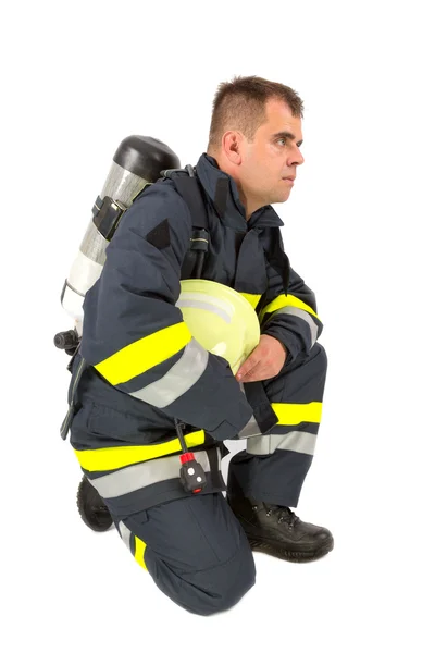 Bombeiro em uniforme isolado em branco — Fotografia de Stock