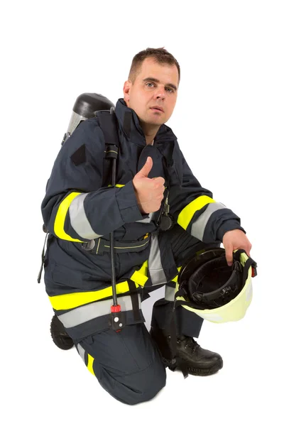 Fireman in uniform isolated in white — Stock Photo, Image