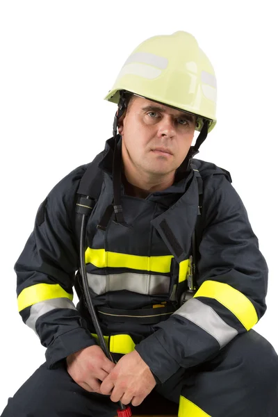 Bombero en uniforme aislado en blanco — Foto de Stock