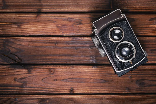 Vintage camera on wooden background — Stock Photo, Image