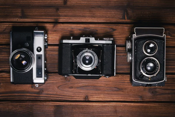 Vintage kamera på trä bakgrund — Stockfoto