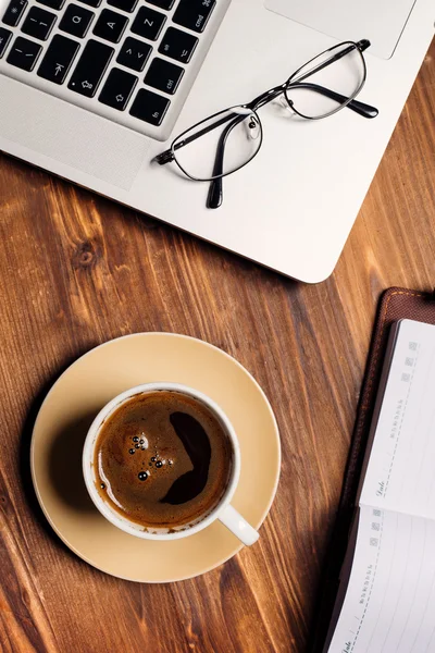 Wooden table with office supplies