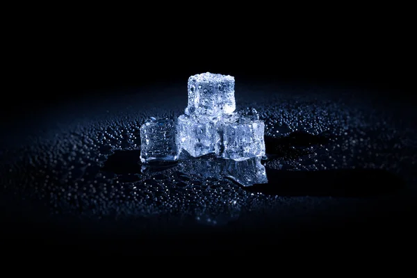 Beautiful ice cube on a black background — Stock Photo, Image