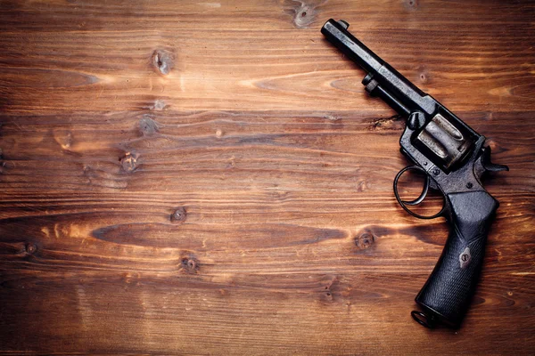 Vintage pistols on wooden background — Stock Photo, Image