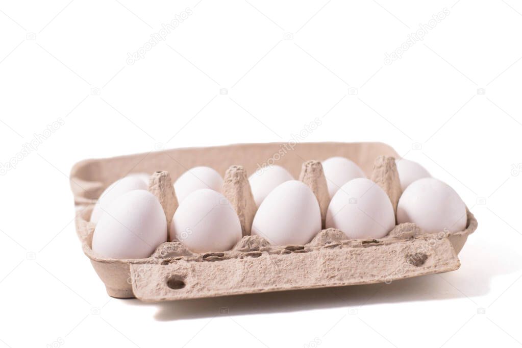 Eggs in a special tray, isolate on a white background. Fresh food from the store.