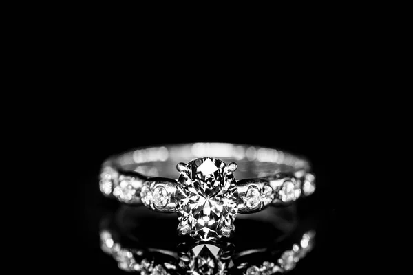 ring with diamonds on black background